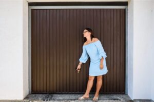 What causes a garage door to close then open back up